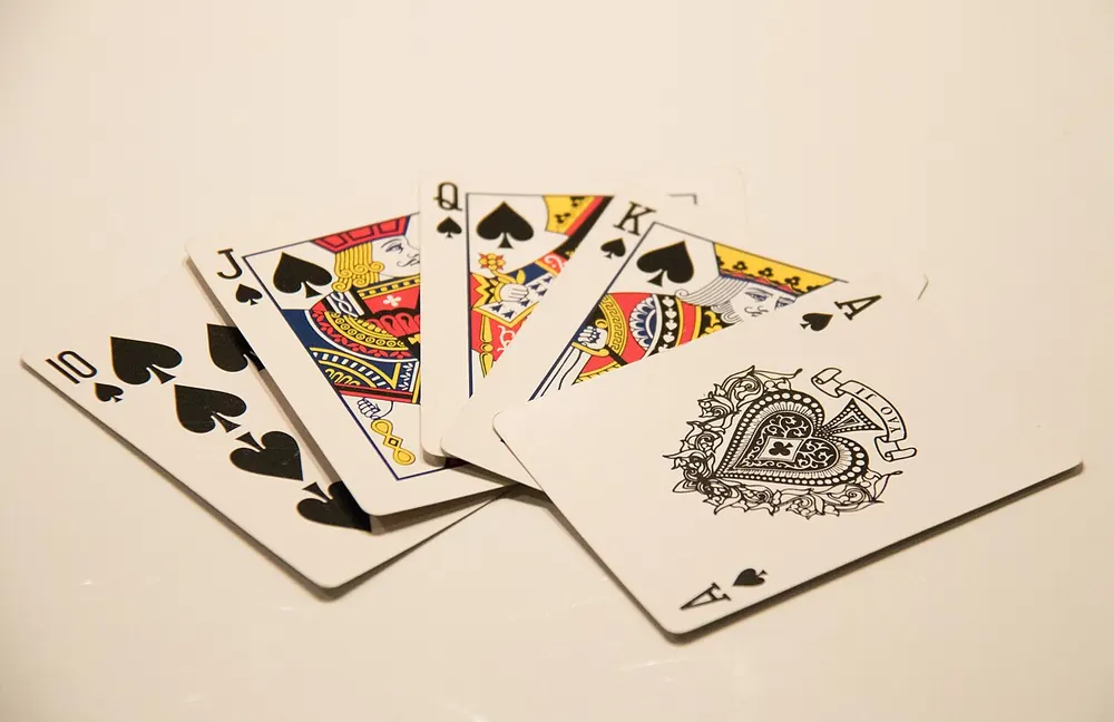 Spread of playing cards on a white table