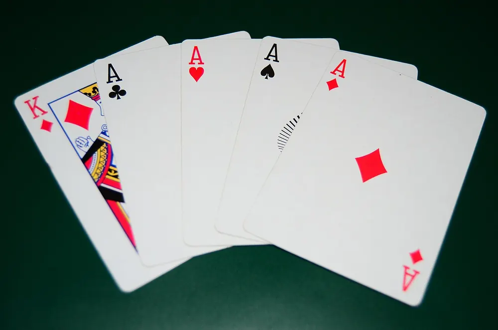 Playing cards fanned out on a red background
