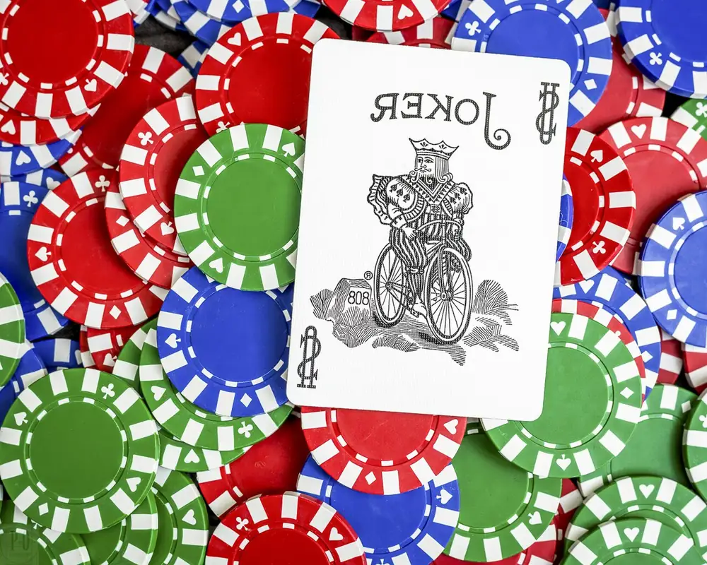 Joker card on a pile of poker chips