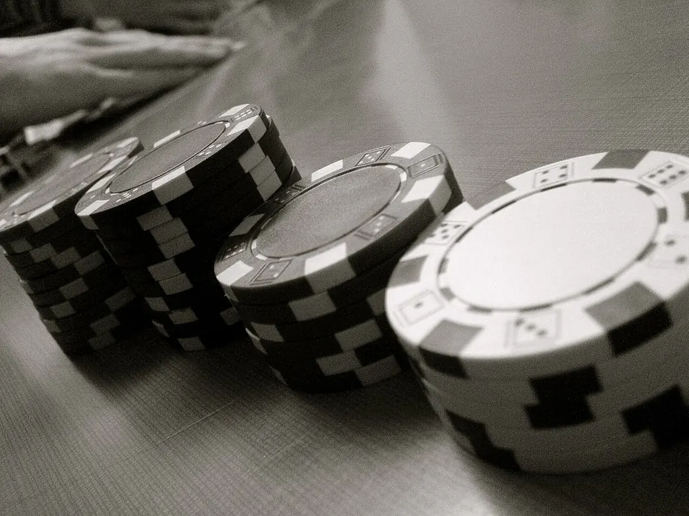 Small stacks of poker chips, a low-budget bankroll