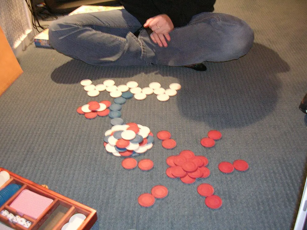 Stacked poker chips in bold colors, the stakes on a roulette strategy
