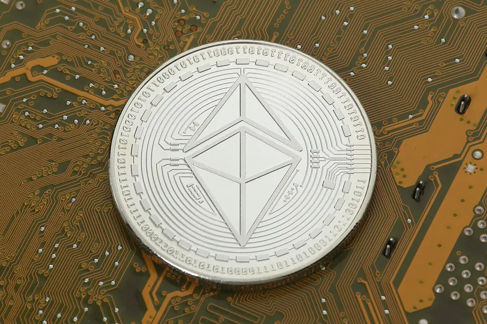 Silver Ethereum coin on a circuit board, loot from a CS2 weekly care package