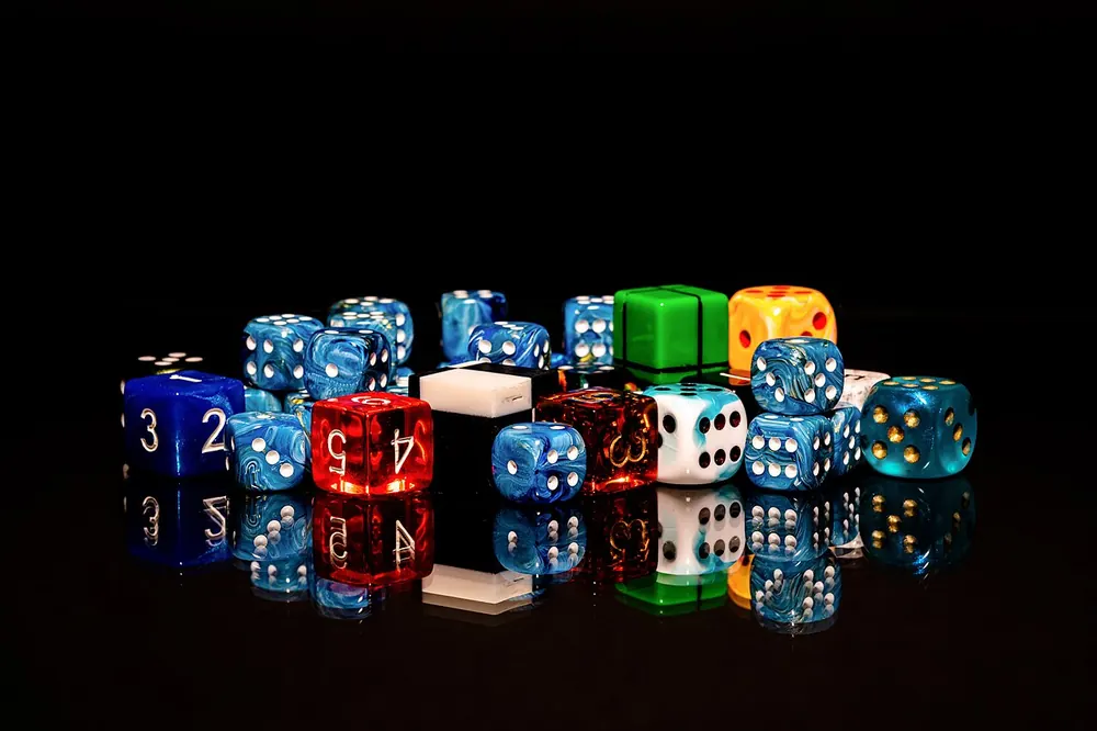 Mixed pile of colorful dice, plenty of options when looking for CSGOEmpire alternatives