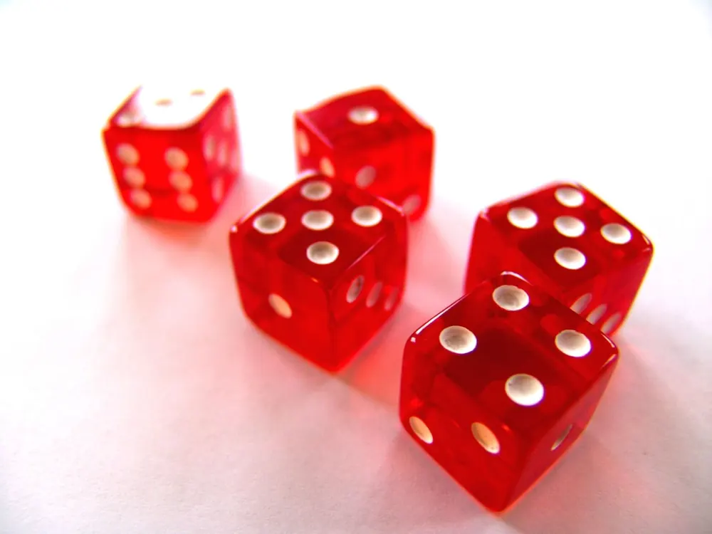 Red translucent dice, a roll of luck like a roulette spin