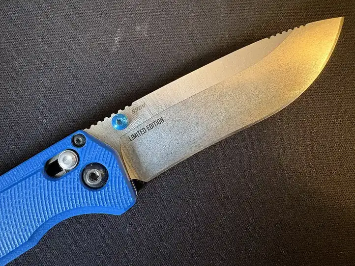 Folding knife with a blue handle