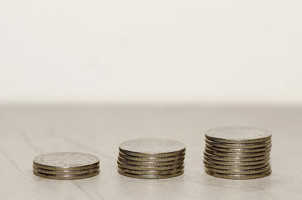 Stacks of Canadian coins, the value you put into a CS2 trade-up contract