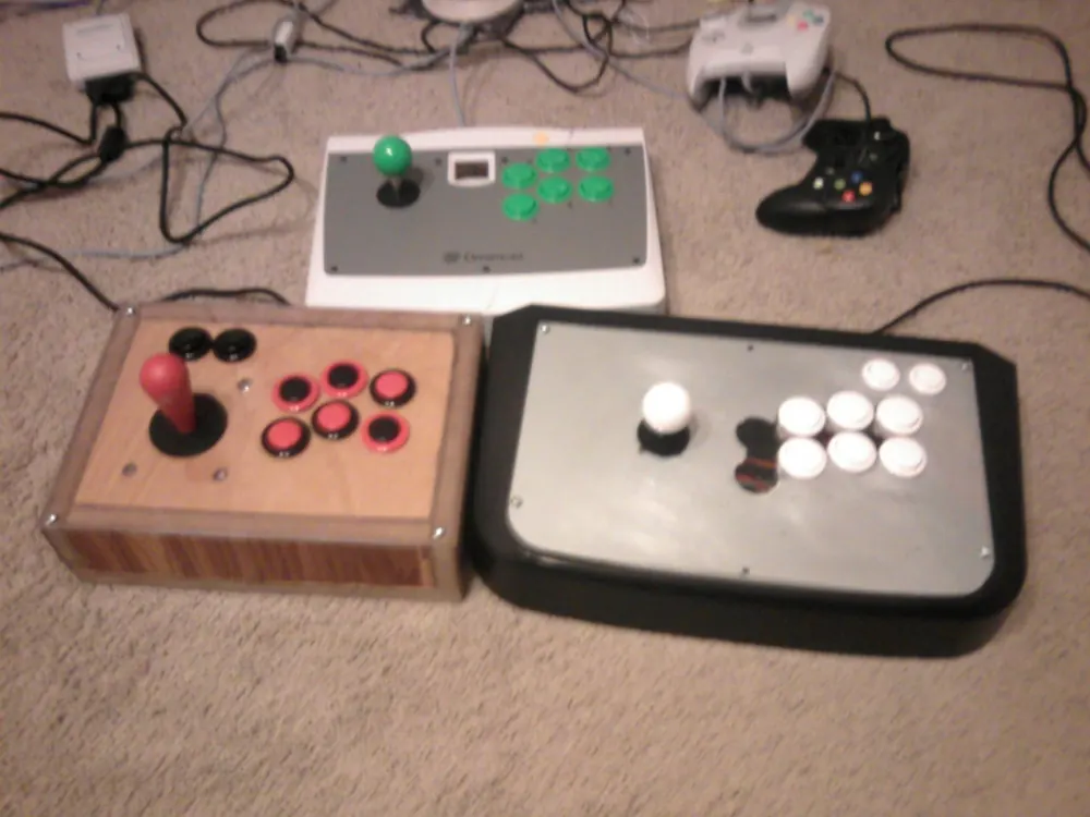 Arcade sticks and gaming controllers on a table, ready to watch with a CS2 viewer pass