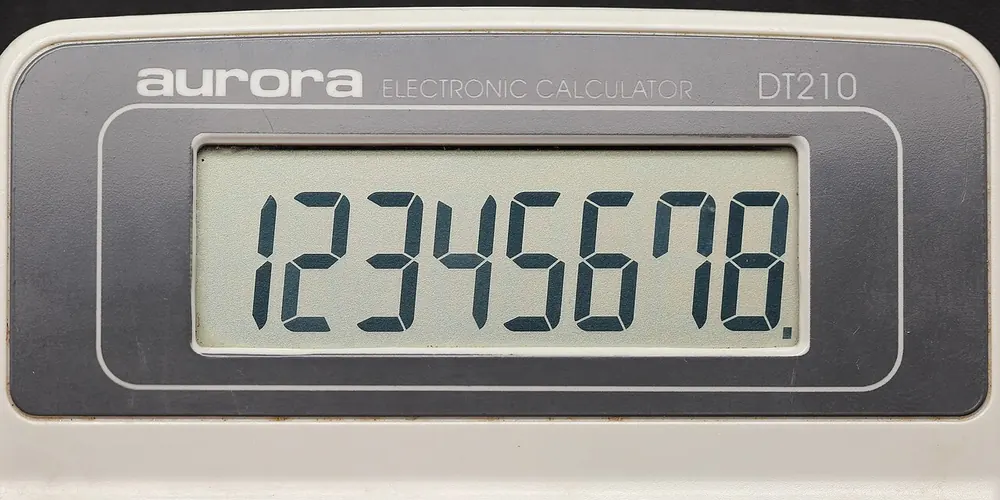 Electronic calculator display, comparing CS2 gambling with case opening